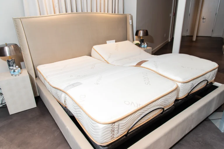 Split king adjustable bed with two twin XL fitted sheets staying secure during head and foot elevation